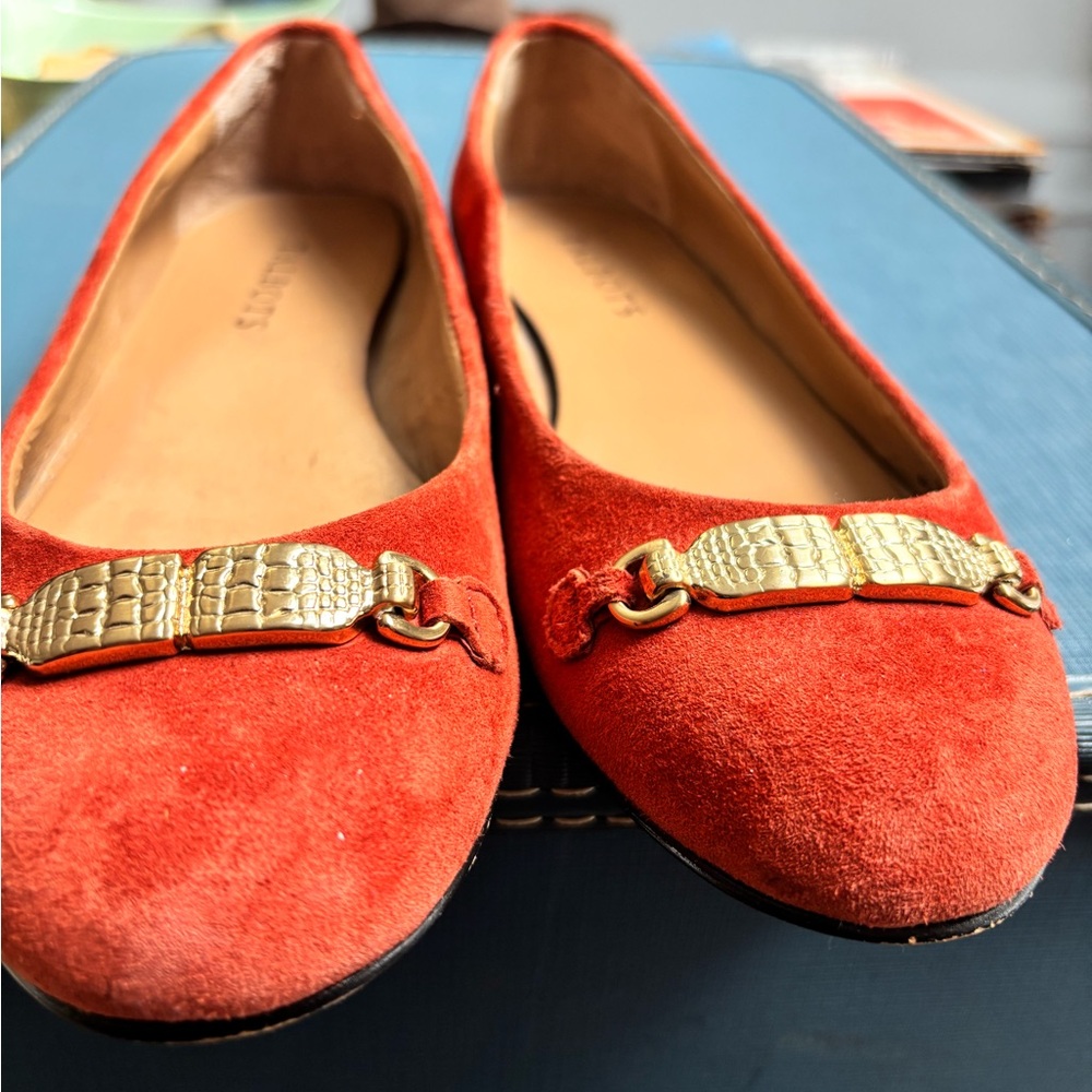 orange suede ballet flats are  by Talbots. Size 6.5m